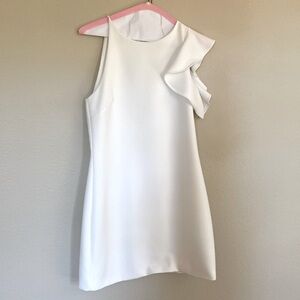 Flirty  white fitted mini with one shoulder ruffle